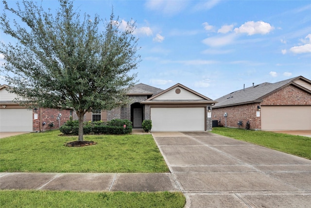 ranch-style home with driveway, an attached garage, central air condition unit, a front lawn, and brick siding