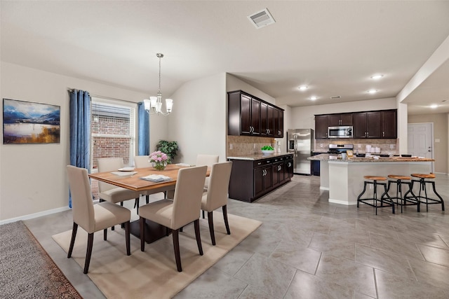 dining space with an inviting chandelier, baseboards, visible vents, and recessed lighting