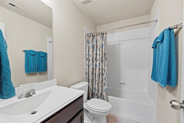 bathroom with shower / bath combination with curtain, visible vents, toilet, vanity, and tile patterned floors