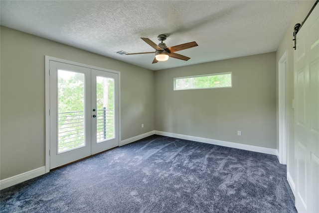 spare room with baseboards, visible vents, dark colored carpet, and french doors