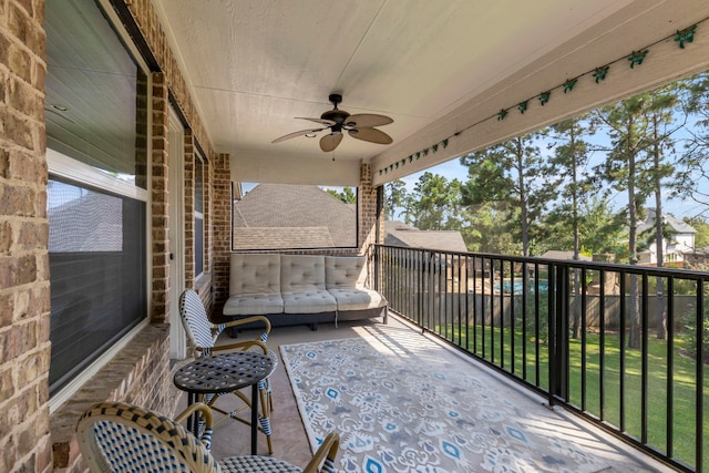 exterior space featuring a ceiling fan