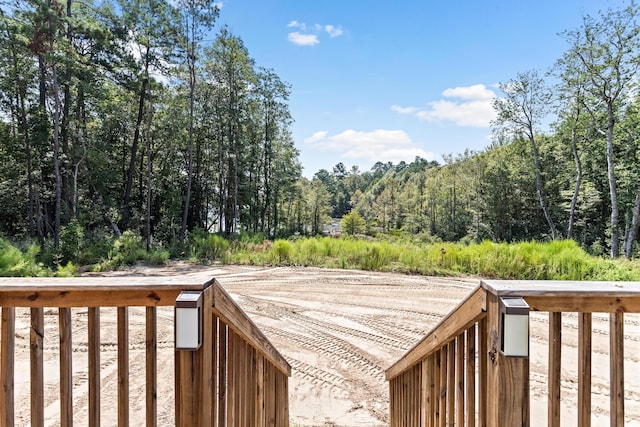 deck featuring a wooded view