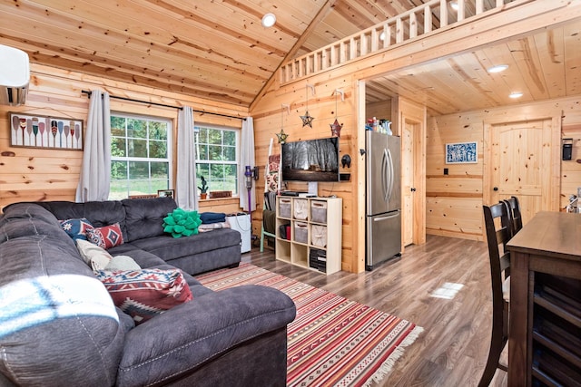 334 County Road 3190, Colmesneil, TX 75938 - living area featuring wood ceiling, lofted ceiling, wood finished floors, wood walls, and a wall unit AC