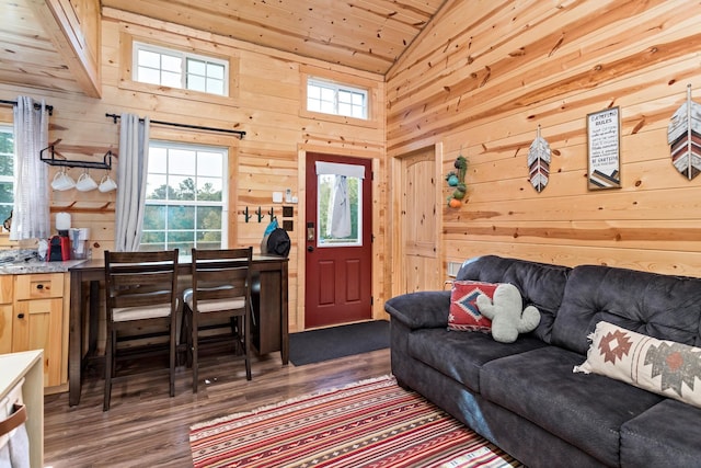 living room featuring high vaulted ceiling, wood walls, dark wood-style flooring, and wood ceiling