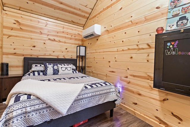 bedroom featuring a wall unit AC, vaulted ceiling, wood walls, and wood finished floors