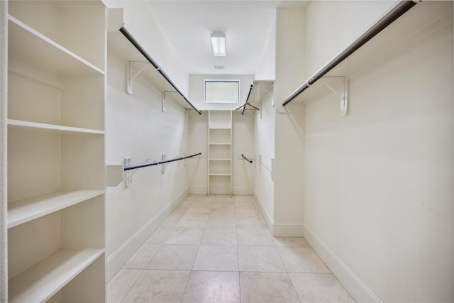 spacious closet featuring light tile patterned floors and visible vents