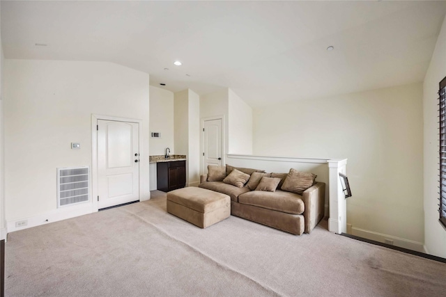 living room featuring light carpet, baseboards, visible vents, vaulted ceiling, and recessed lighting