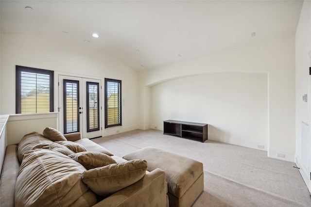 living area with french doors, recessed lighting, light colored carpet, vaulted ceiling, and baseboards