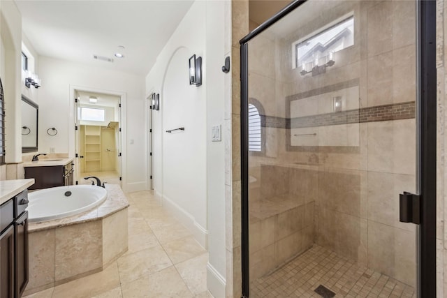 full bath featuring a healthy amount of sunlight, a stall shower, visible vents, and a bath