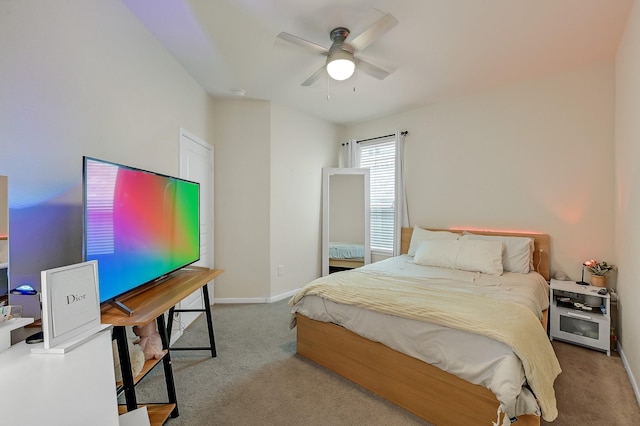 bedroom featuring carpet floors, baseboards, and a ceiling fan