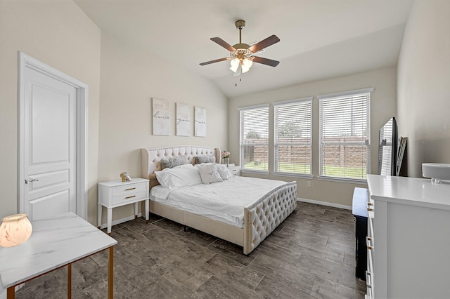 bedroom featuring lofted ceiling, ceiling fan, and baseboards