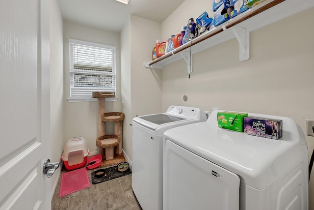 laundry room featuring laundry area, baseboards, independent washer and dryer, and light wood finished floors