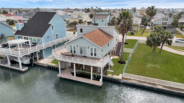 aerial view with a water view and a residential view