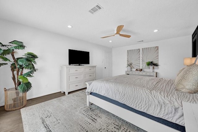 bedroom with baseboards, visible vents, ceiling fan, wood finished floors, and recessed lighting