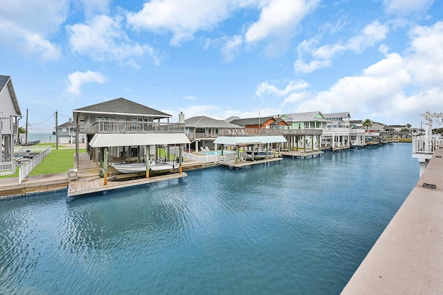 dock area featuring a residential view, a water view, and boat lift