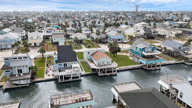 drone / aerial view featuring a water view and a residential view