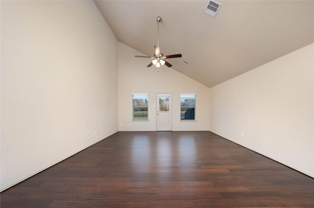 spare room featuring dark wood-style floors, ceiling fan, high vaulted ceiling, and visible vents