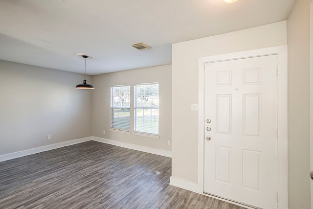 entryway with dark wood-style floors, baseboards, and visible vents