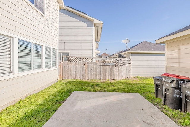 view of yard with a patio and fence