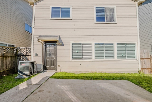 exterior space with a patio, fence, and central AC unit