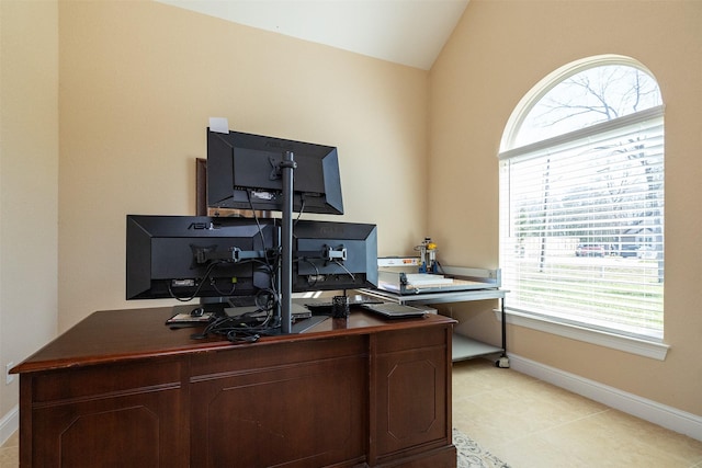 office area with vaulted ceiling and baseboards