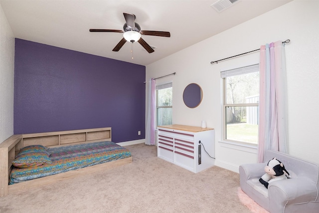 bedroom with carpet, visible vents, ceiling fan, and baseboards