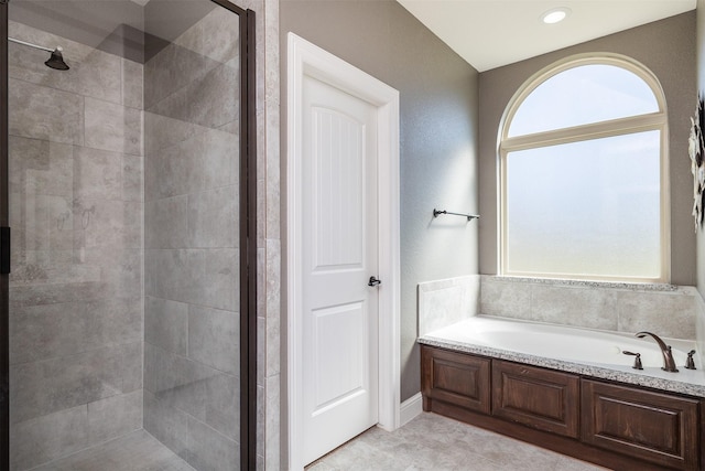 full bathroom with tile patterned flooring, a shower stall, and a bath