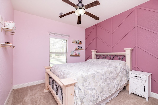 bedroom with baseboards, visible vents, a ceiling fan, and light colored carpet