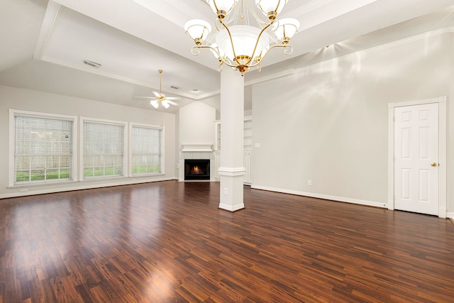 unfurnished living room featuring wood finished floors, vaulted ceiling, a lit fireplace, and ceiling fan with notable chandelier