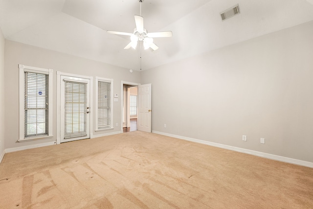 empty room with light carpet, baseboards, visible vents, and ceiling fan