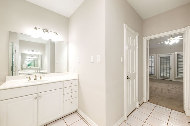 bathroom with ceiling fan, baseboards, vanity, and tile patterned floors