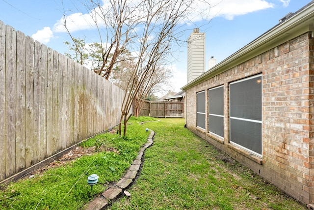 view of yard featuring a fenced backyard