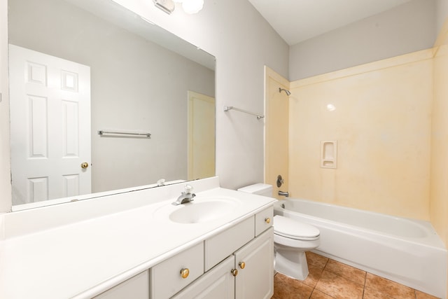 bathroom featuring shower / bathing tub combination, vanity, toilet, and tile patterned floors