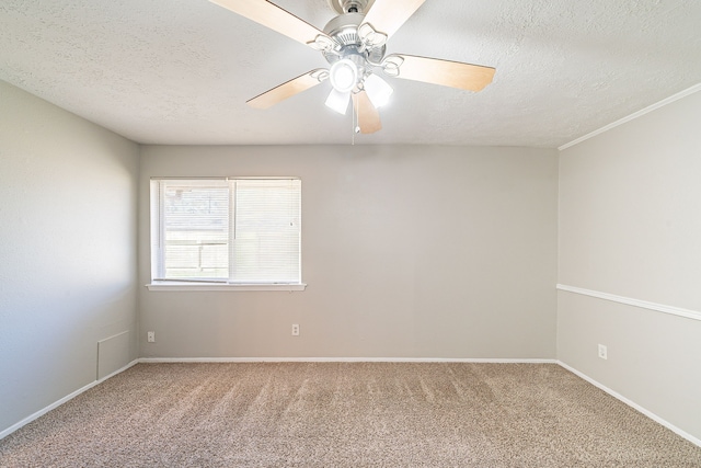 unfurnished room with a textured ceiling, ceiling fan, carpet, and baseboards