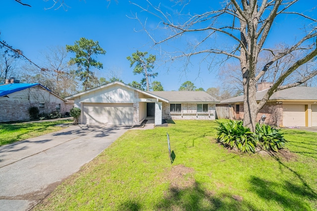 view of front of property with an attached garage, driveway, brick siding, and a front yard