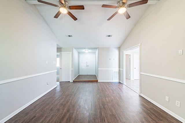 empty room featuring dark wood-style floors, visible vents, and baseboards