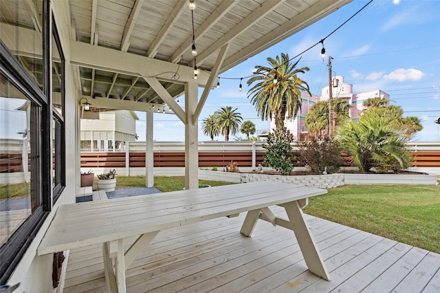 wooden terrace with a yard