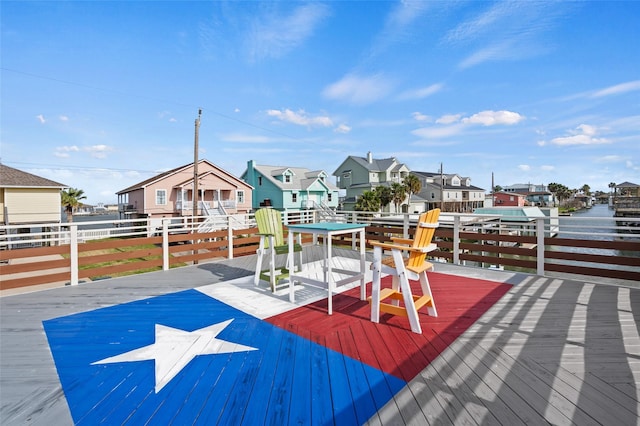 deck featuring a residential view and fence