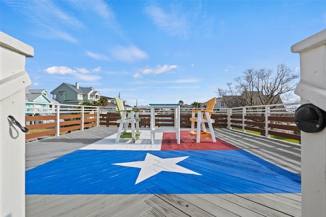 wooden terrace with a residential view