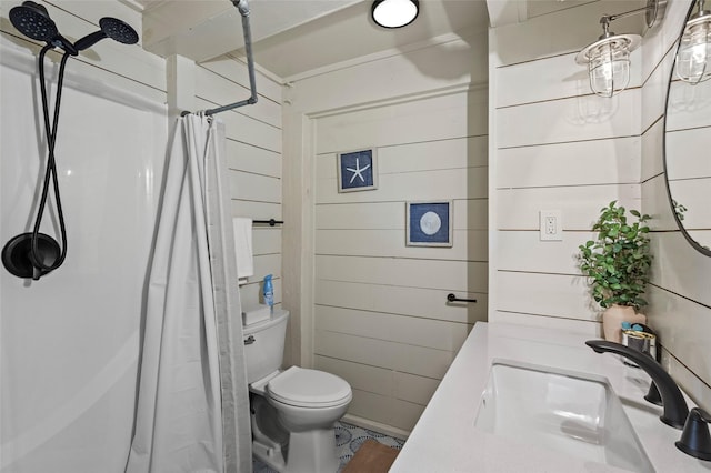 full bath with a shower with shower curtain, a sink, toilet, and wooden walls