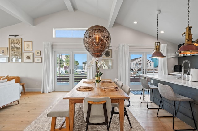 dining space featuring high vaulted ceiling, recessed lighting, beam ceiling, and light wood-style flooring