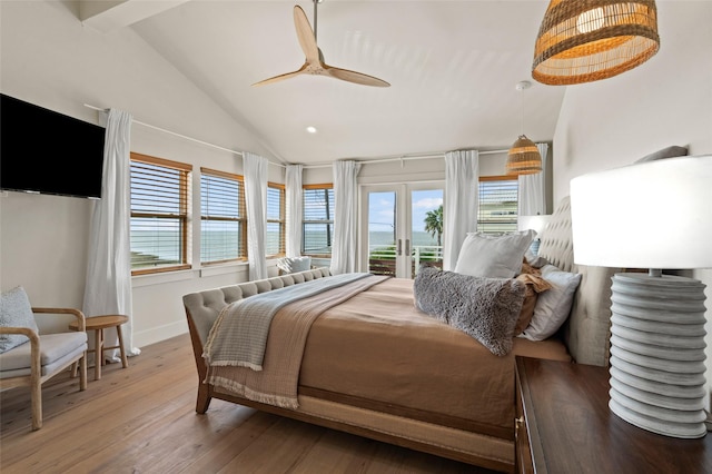 bedroom featuring lofted ceiling with beams, wood finished floors, baseboards, access to outside, and french doors