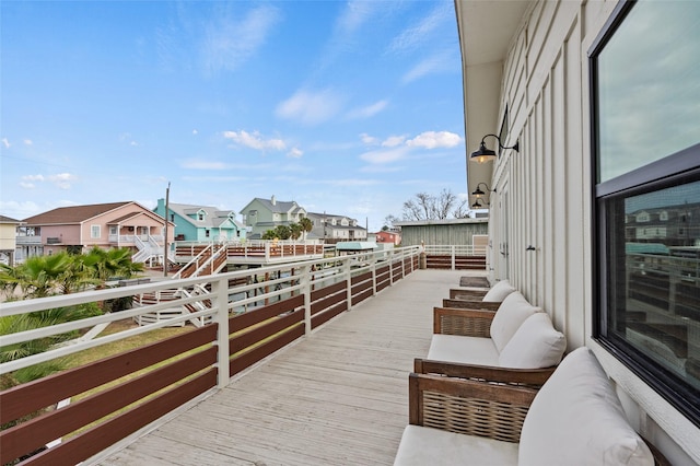 wooden terrace with a residential view