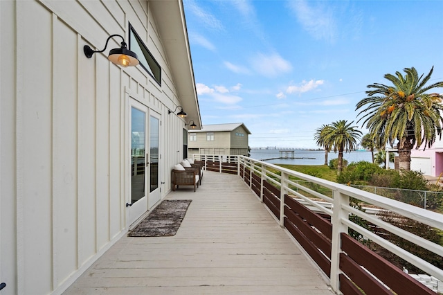 wooden terrace with a water view