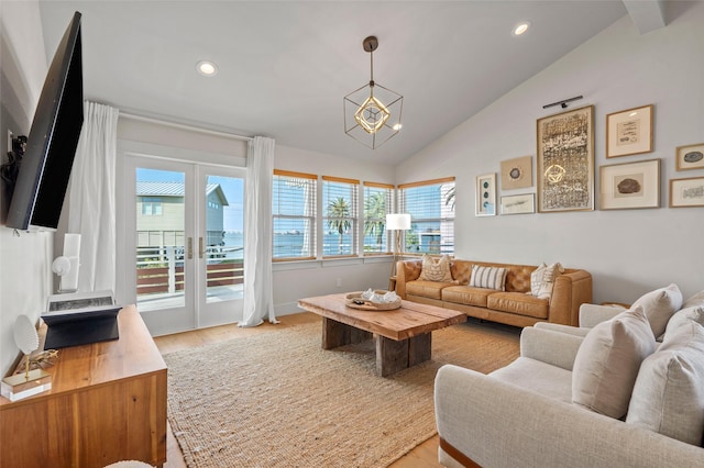 living area featuring light wood-style floors, recessed lighting, and vaulted ceiling