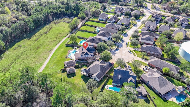 birds eye view of property with a residential view