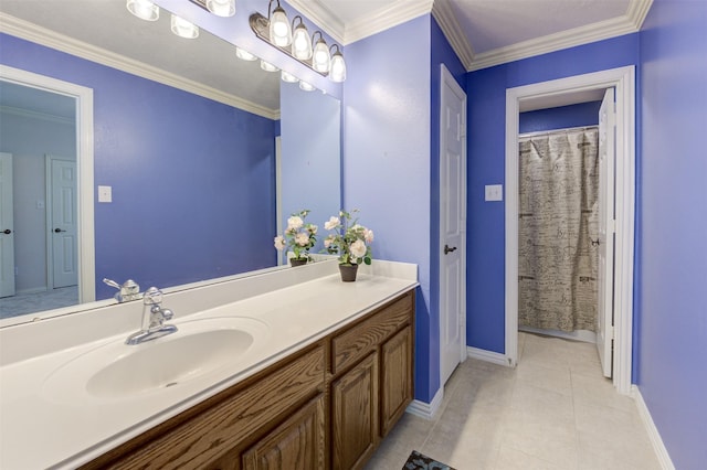 bathroom with baseboards, vanity, ornamental molding, and tile patterned floors