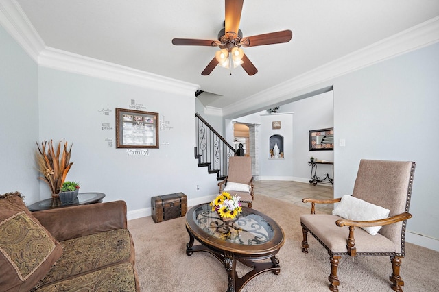 tiled living room with ceiling fan, baseboards, stairs, ornamental molding, and ornate columns