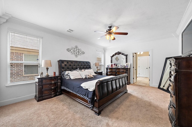 bedroom featuring light carpet, baseboards, visible vents, and crown molding