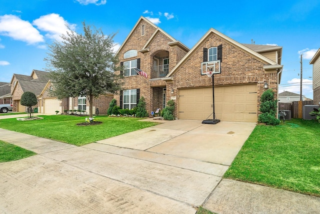 traditional home with a front yard, concrete driveway, brick siding, and an attached garage